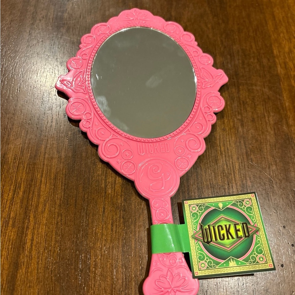 Pink Handheld Mirror. Pink on one side and green on the other side